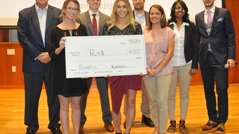 2017 student startup winners with Launch It judges and organizers plus a big check