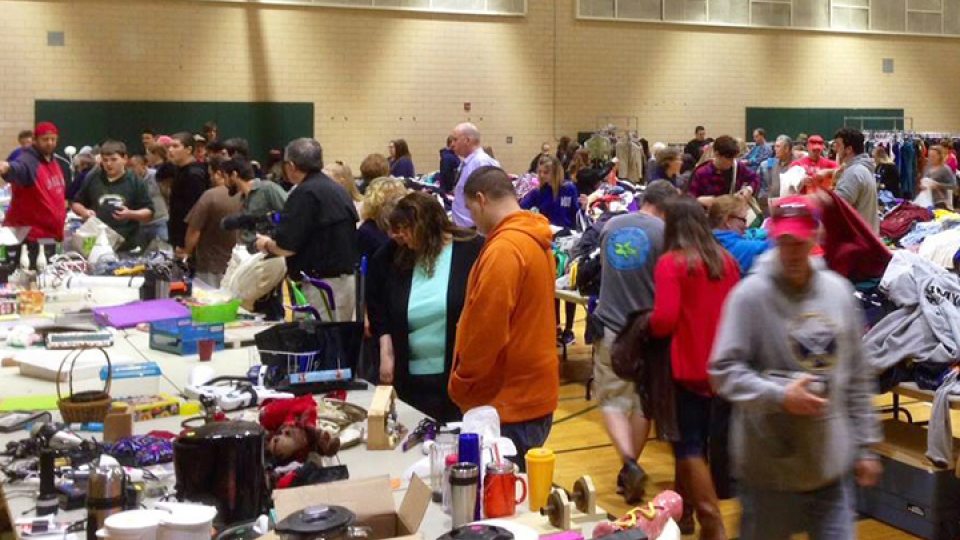Shoppers browse for bargains on tables during Leave Green sale