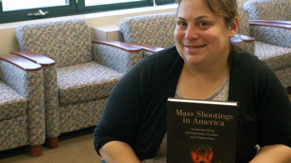 Jaclyn Schildkraut with mass shootings resource book