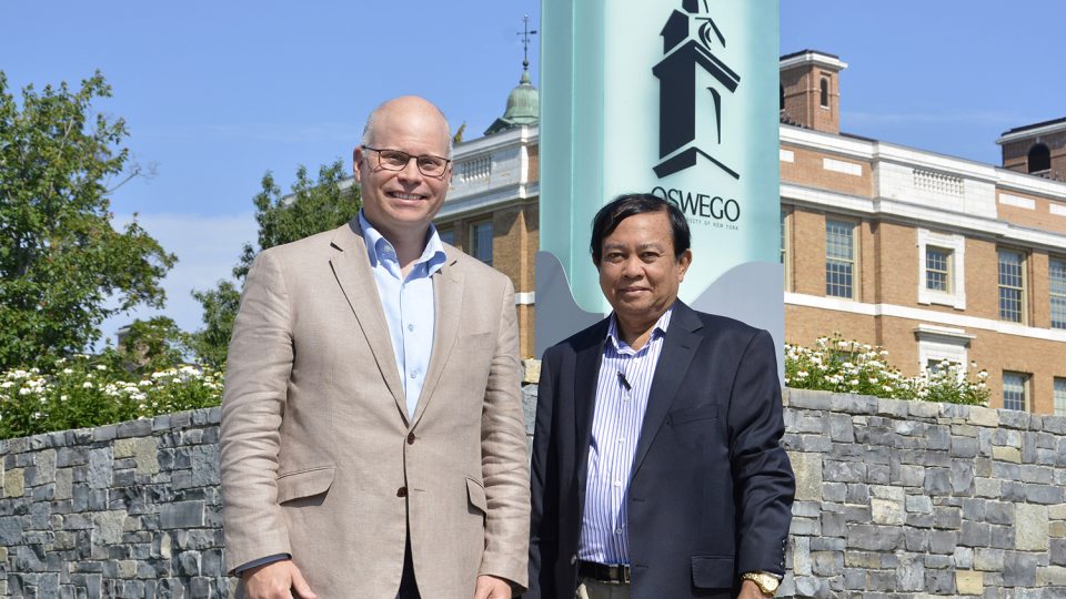 Dr. Joshua McKeown (left), director of SUNY Oswego's Office of International Education and Programs, mentors physician and educator Dr. Myint Oo, who recently traveled from Myanmar to learn more about fostering international education opportunities