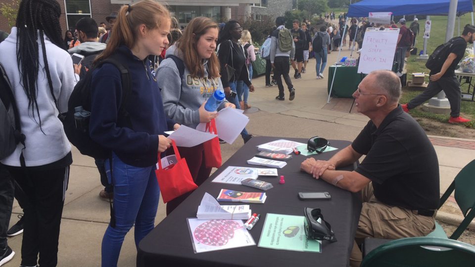 Robert Lighthall of the Oswego County Sheriff's Department speaks with students at a previous Mental Health and Wellness Fair