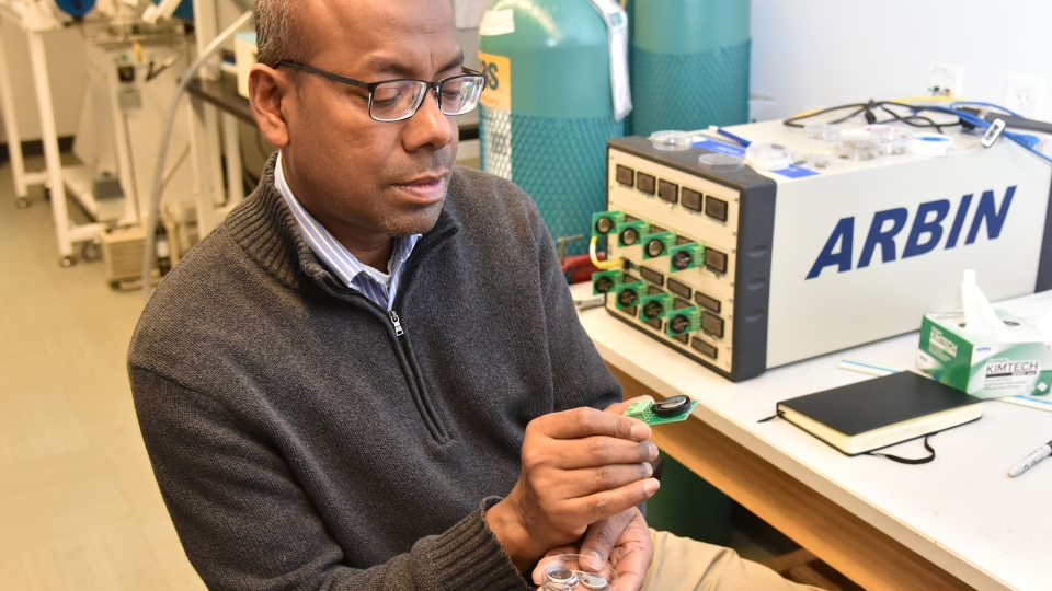 Professor Mohammad Islam showcases his sustainable batteries in the Shineman Center physics lab.