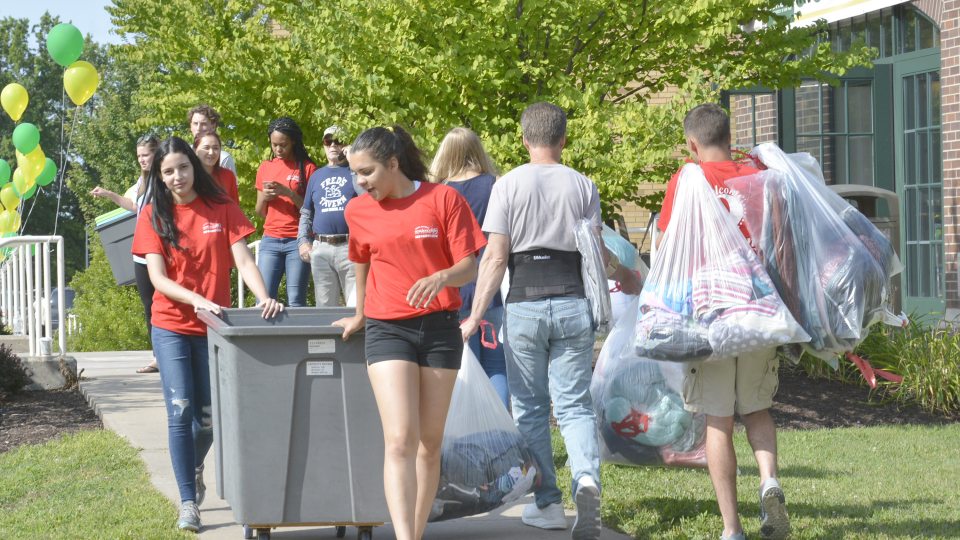 Red Carpet Crew members help move new students onto campus
