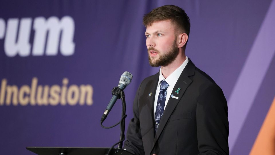 Caleb Munski speaks at the NCAA Inclusion Forum
