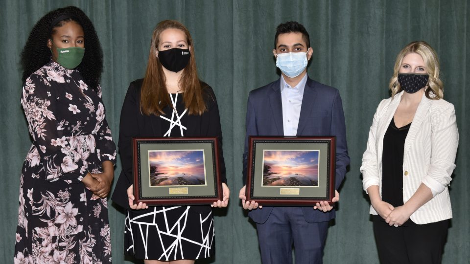Koushank Harinder Singh Ahuja and Olivia Colon (second and third from left) earn congratulations from Kerisha Lewis (left) and Laura Kelly (right) for winning the Outstanding Student Awards