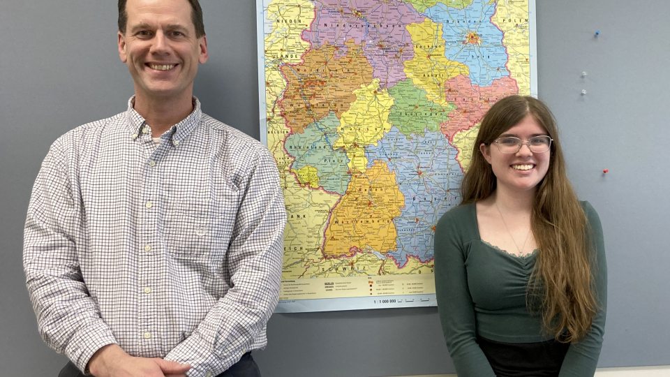 Patrick Schultz of the Modern Languages and Literatures Department congratulates SUNY Oswego student Marie Parker on receiving a German Academic Exchange Service (Deutscher Akademischer Austauschdienst, or DAAD) grant to study this summer in Germany.