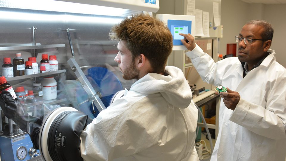 Student Josh Willson and faculty member Dr. Mohammad Islam work in a lab