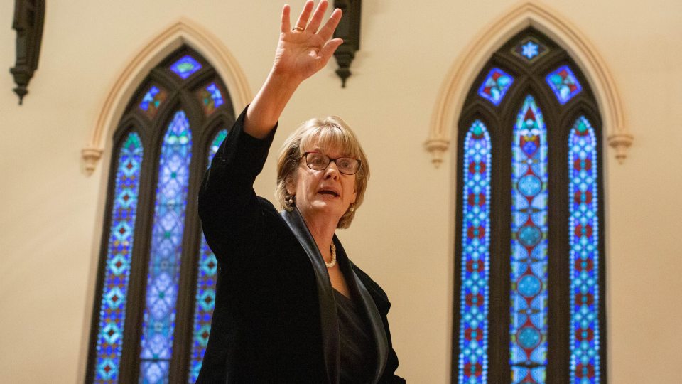 Julie Pretzat directing the Syracuse Vocal Ensemble
