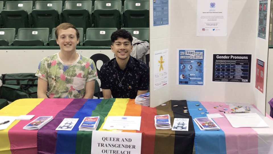 Students with the Queer and Trans Outreach Center participate in the Student Involvement Fair