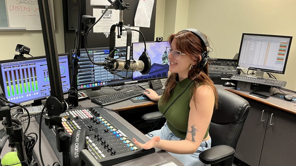 Raina Horitz works in the WNYO radio studio