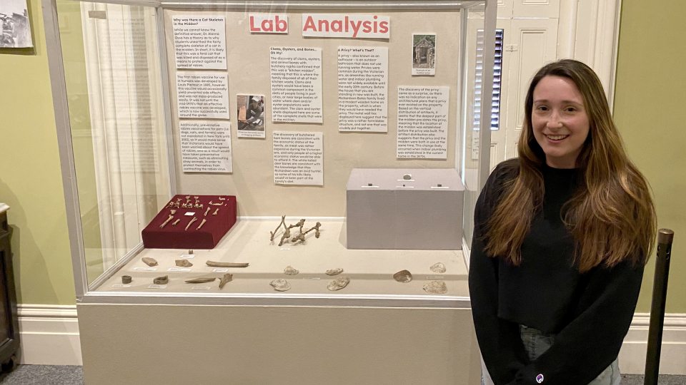 May anthropology graduate Nerissa Conklin shows an exhibition she created at the Richardson-Bates House Museum about the university's field school.