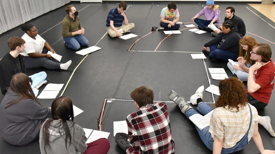 The cast of Romeo and Juliet take part in a reading early in the production cycle
