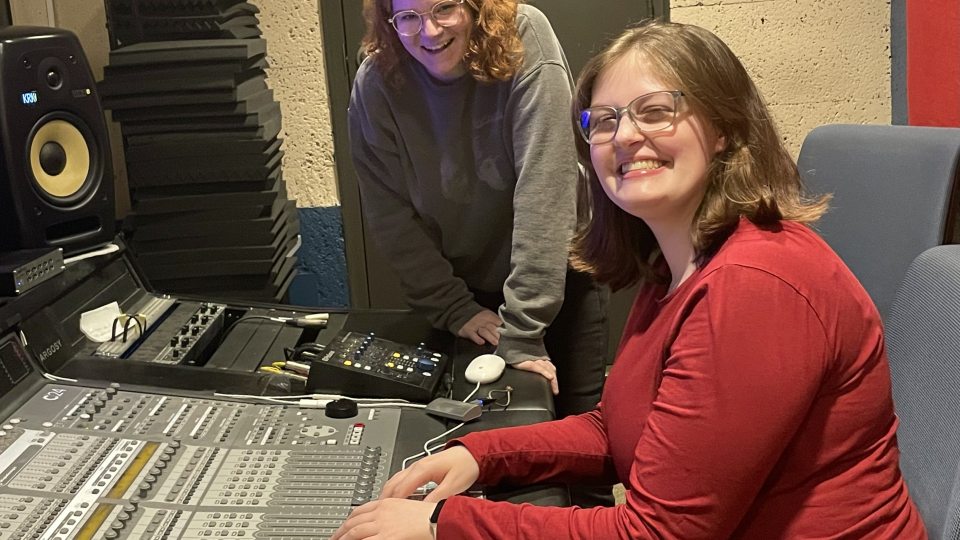 Oswego broadcasting students Samantha Kearney (left) and Jaime Hunter (right) pose for a photo in the recording studio in Lanigan Hall.