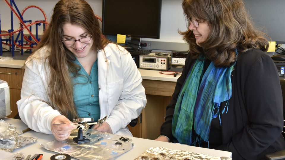 Lauren Samson and Carolina Ilie showing off research