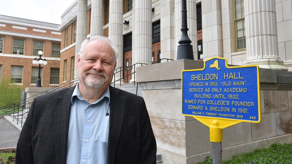 Tyler Art Gallery director Mike Flanagan with historic marker for Sheldon Hall
