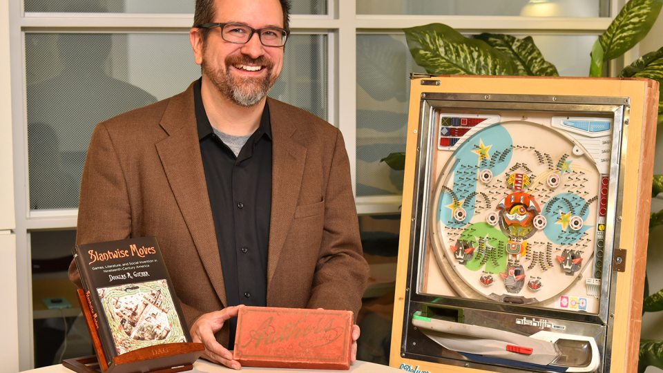 Douglas Guerra of SUNY Oswego’s English and creative writing faculty recently earned the Popular Culture Association’s Ray and Pat Browne Award for his book Slantwise Moves, which connects books, games and 19th-century social lives