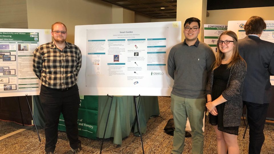 Student who created Smart Garden giving poster presentation