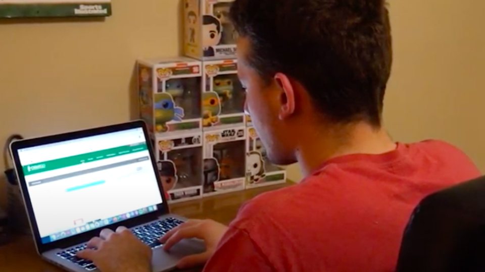 Student works on a computer in a household setting