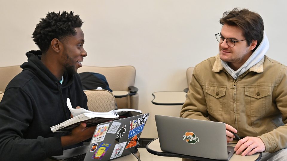 From left, senior broadcasting major Nacir Meikle and junior communication major Holden Reynolds are two of the students in communication studies faculty member Eileen Gilligan's "Community Journalism" class