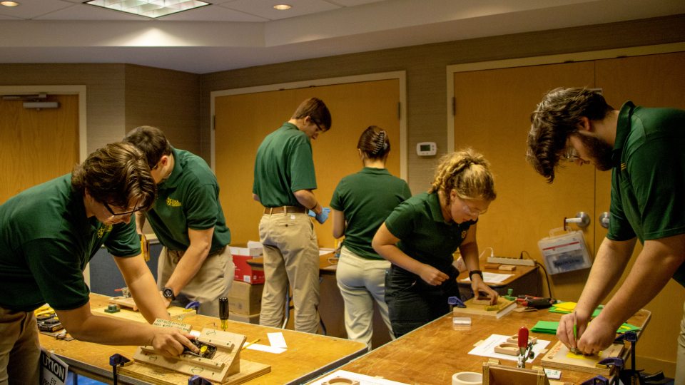 SUNY Oswego technology students work toward a first-place finish in the TEECA Manufacturing competition.
