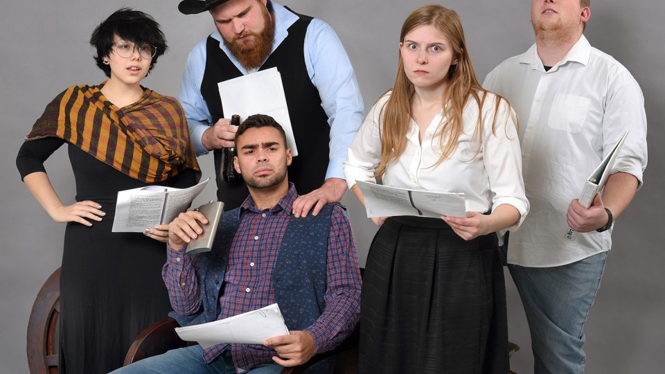 Performers preparing for staged reading of Western play