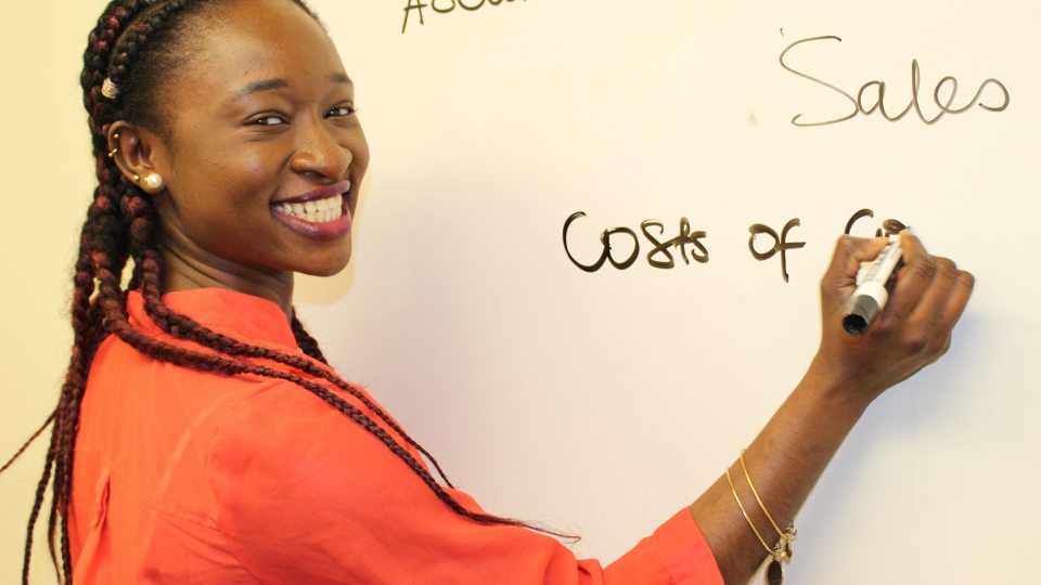 Charlene Assam writing on board