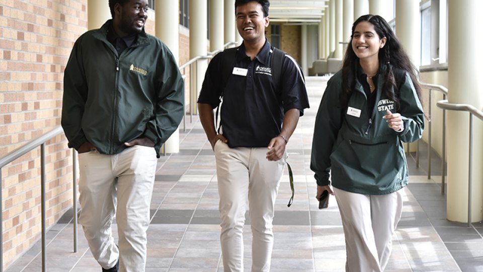 International student leaders walking through the Marano Campus Center.