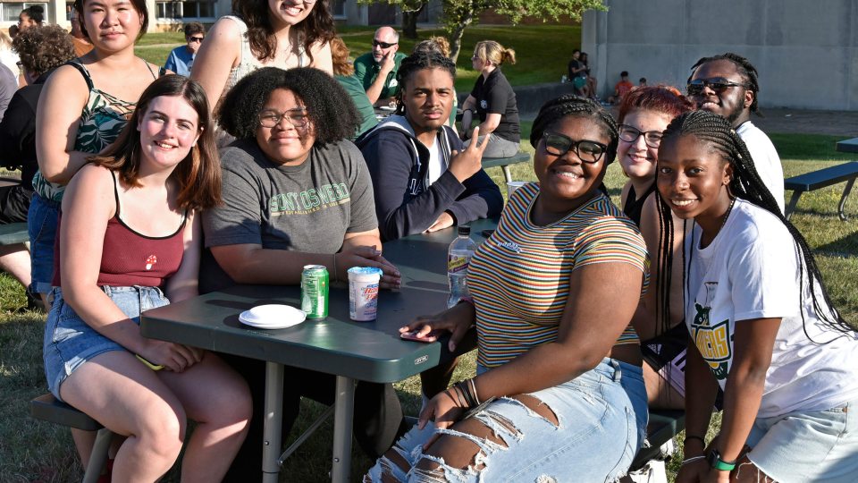 Newer students enjoying the welcoming picnic