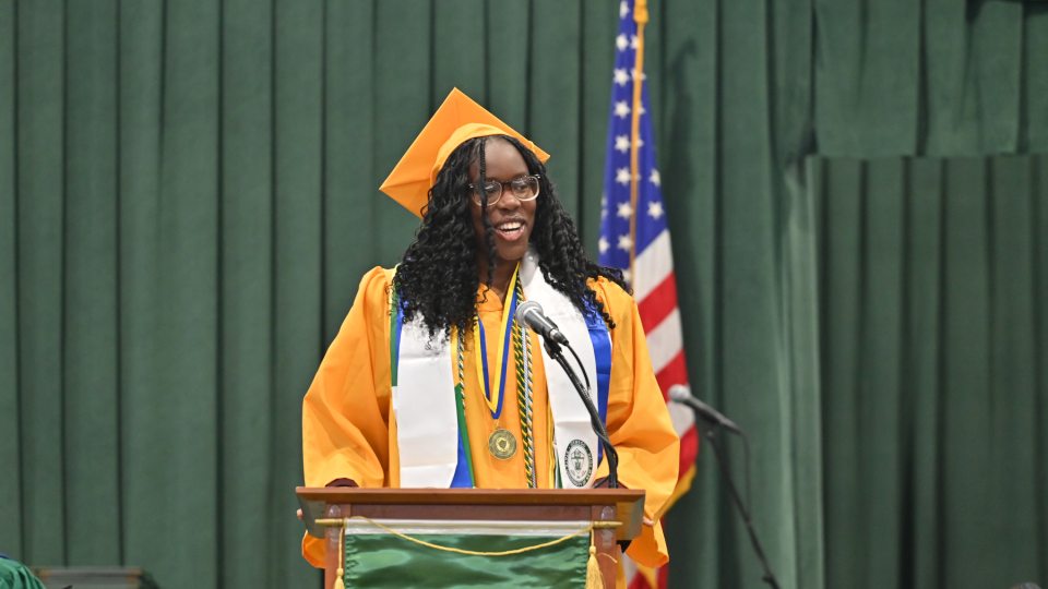 Student Association President Oghenetega “Tega” Adjoh speaks to her fellow the Class of 2026 graduates during May Commencement.