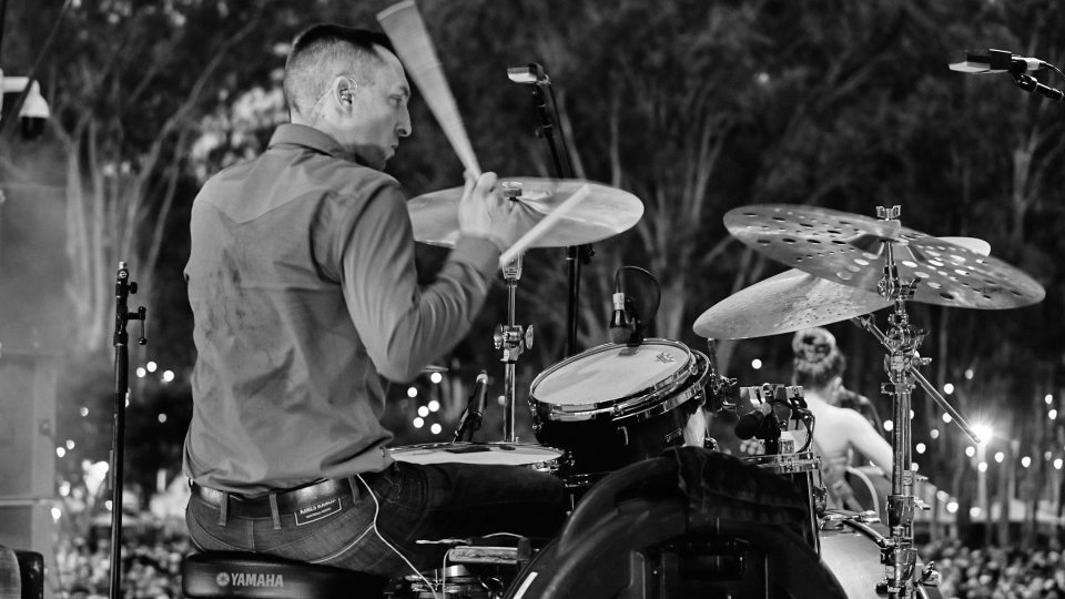 Nate Felty '12 playing drums at CMC Rocks Festival in Brisbane, Australia