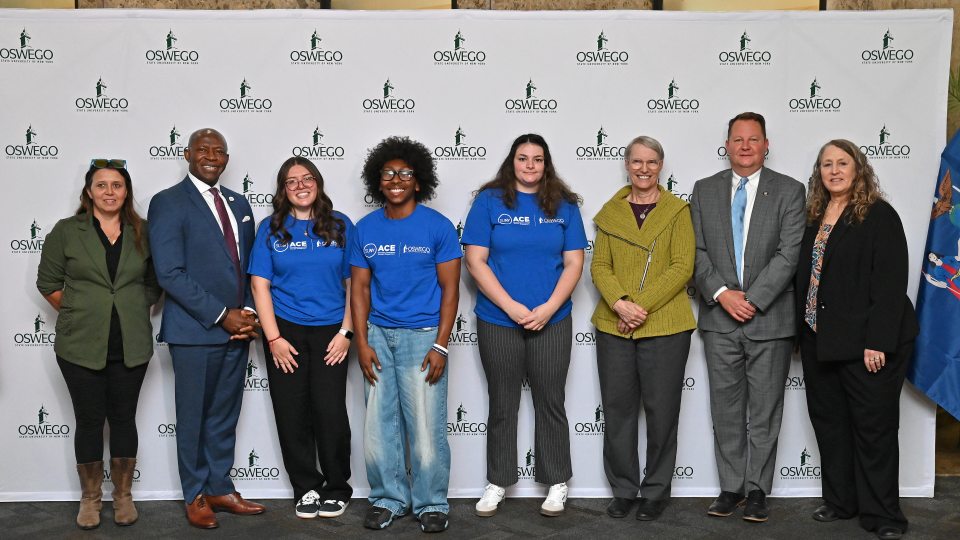 ACE students, Oswego administrators, local officials and Donna Linderman from SUNY