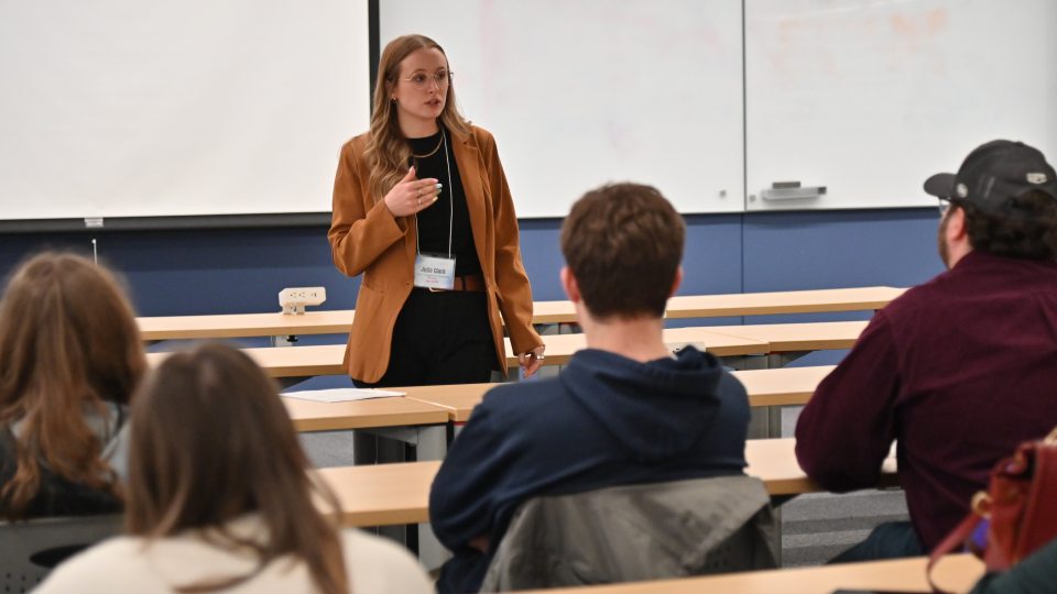 Julia Lavery Clark of Novelis, a 2018 SUNY Oswego graduate, speaks to students during the recent “AI and the Future of Work” summit.