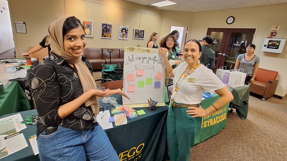 Shown at an outreach event at SUNY Oswego's Syracuse Campus in the fall are Office of the Dean of Students representatives, from left, graduate assistant Sumayya Sagheer; Kimberly Fuqua, university homeless liaison; and April Lopez, coordinator of SHOP