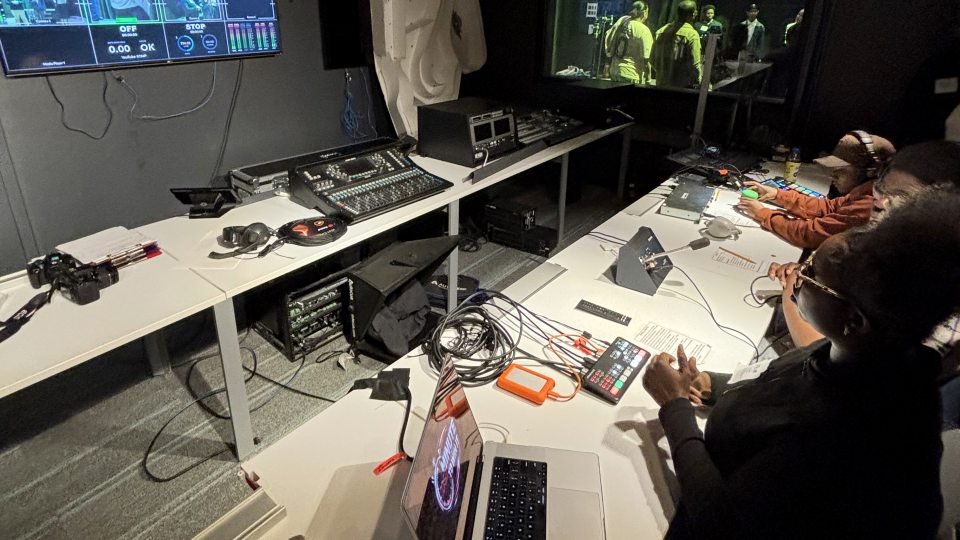 Students work in a broadcast control room
