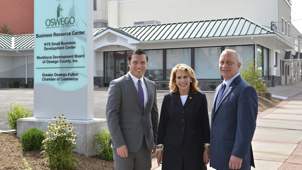 Oswego Mayor William J. Barlow Jr., SUNY Oswego President Deborah F. Stanley and Pathfinder Bank President Thomas W. Schneider, fronting the college's new Business Resource Center in Oswego