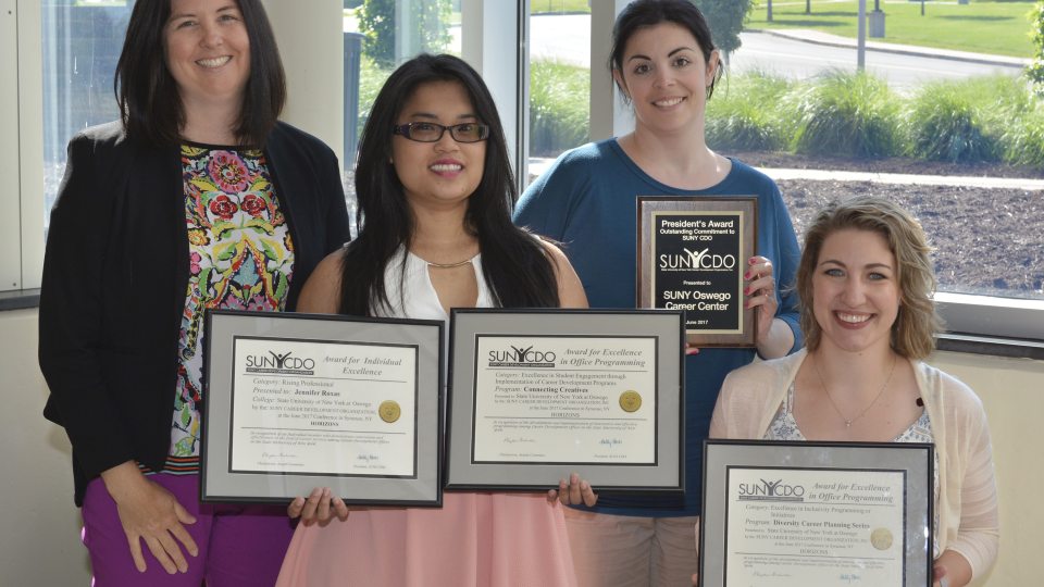 Career Services staff with awards