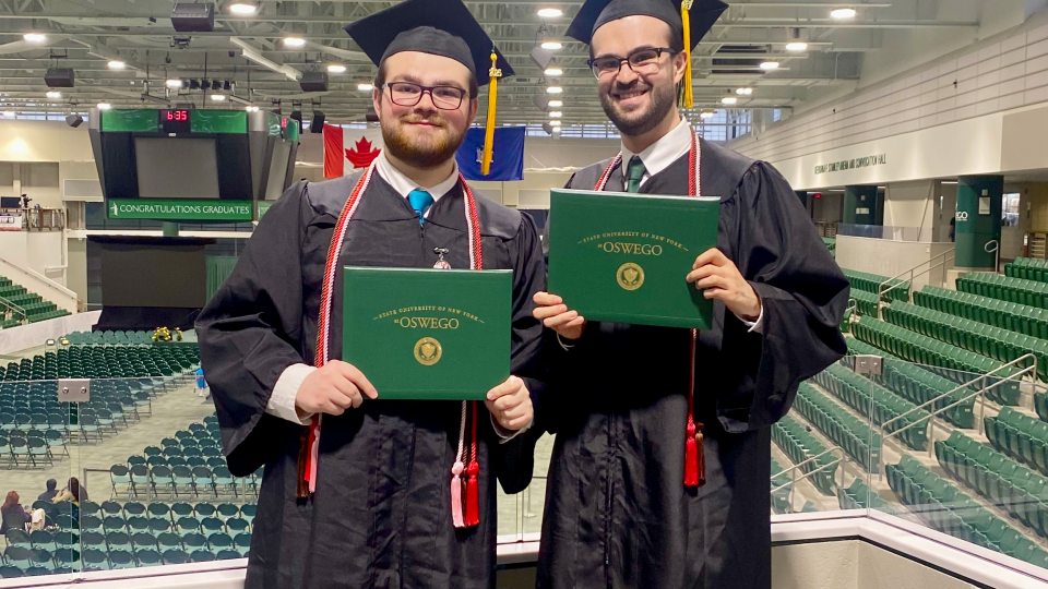 The Campos brothers celebrate together at SUNY Oswego's May 2025 Commencement