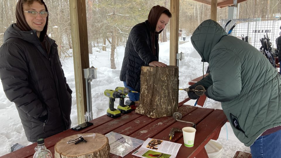 Students show how to drill for sap