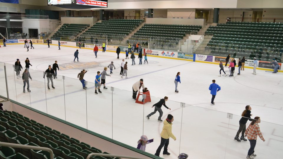 Young people ice skating in Marano Campus Center arena