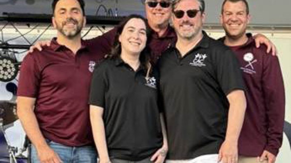 Members of DKK and the CAC gather during DKK’s Centennial and fundraiser benefiting the CAC, from left: James Lalino '10, Abbey Nettle, Pat Magin '91, Tory DeCaire '96 and Thomas DiRoma '11.