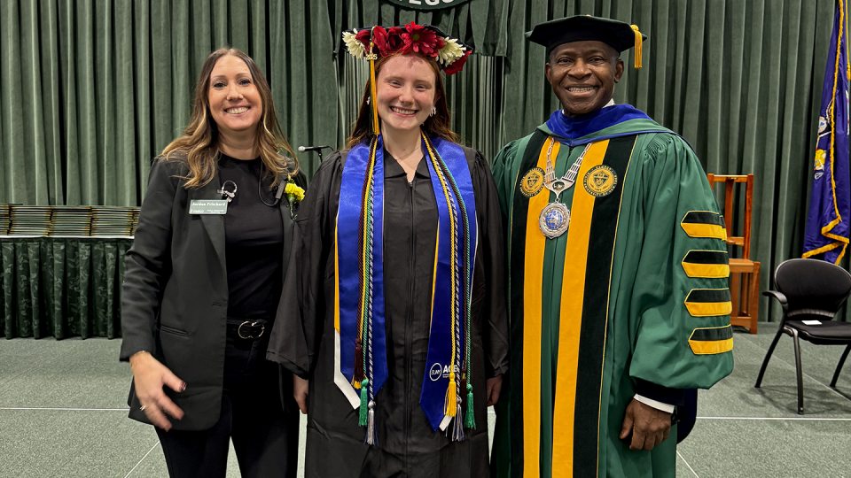 ACE Program Director Jordan Pritchard with the program's first graduate, Emily Colledge, and SUNY Oswego President Peter O. Nwosu.