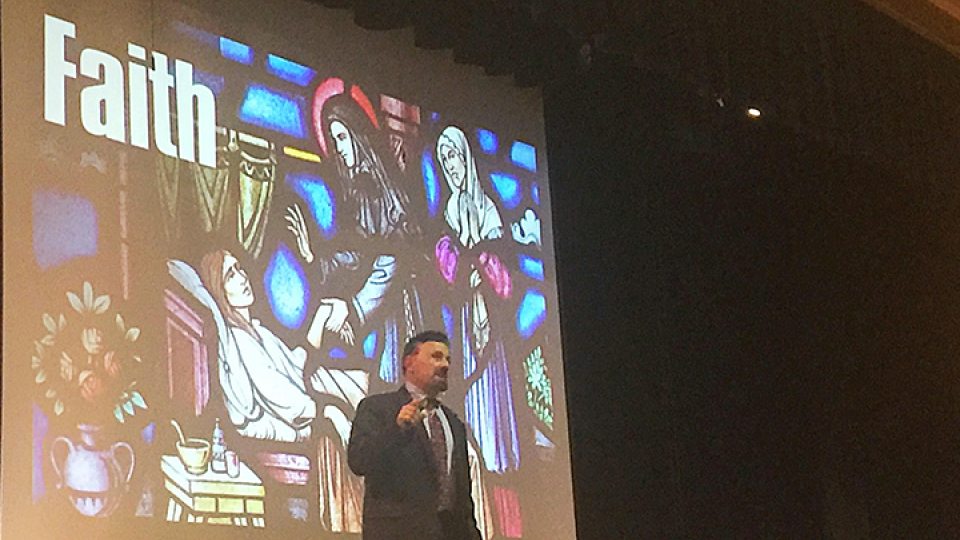 Frank DeAngelis, Columbine's former principal, speaks at national briefing; a slide behind him reads: faith