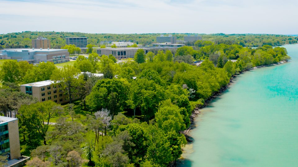 Aerial view of Lake Ontario and campus buildings