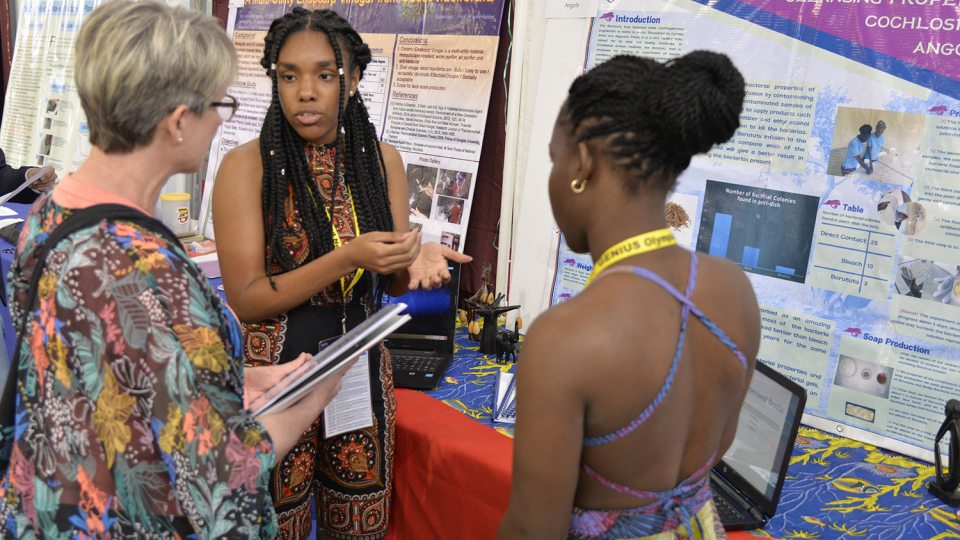 Participants from Angola present to judge at 2017 GENIUS Olympiad