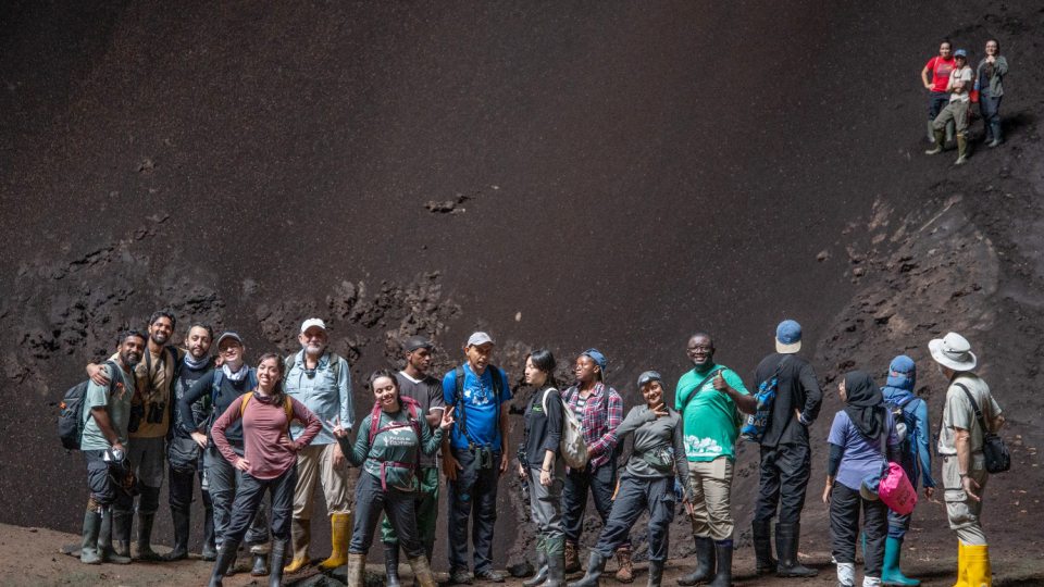 Bat researchers exploring a cave as part of the inaugural Global South workshop