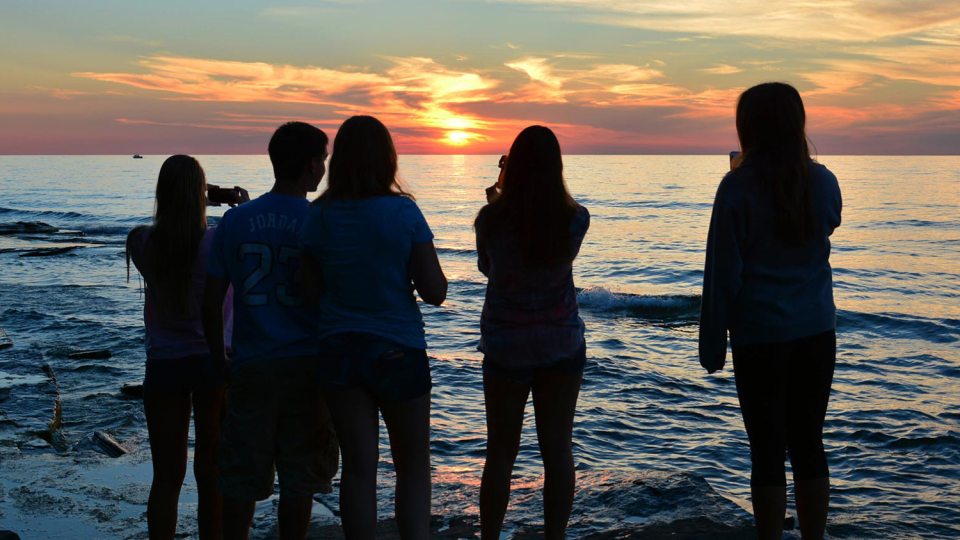 Students taking photos of Lake Ontario