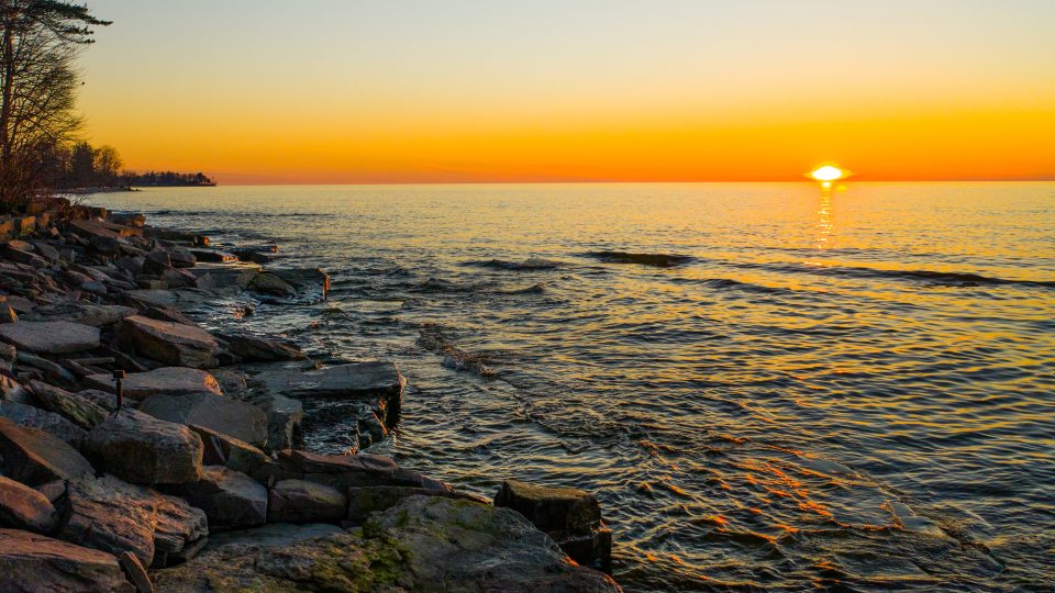 A Lake Ontario sunset paints a variety of hues across the sky