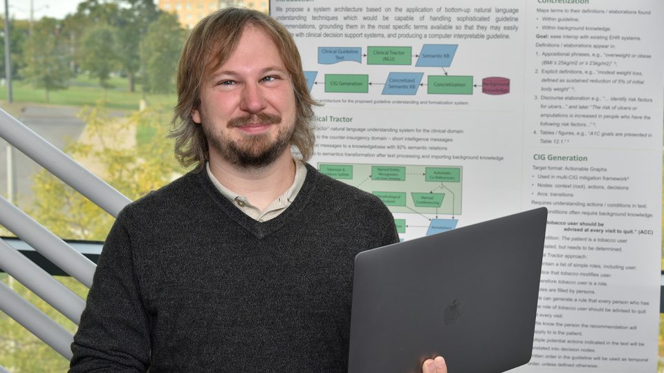 Daniel Schlegel with his research