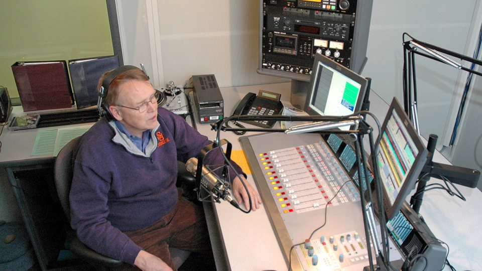 File photo of John Hurlbutt broadcasting from WRVO studios