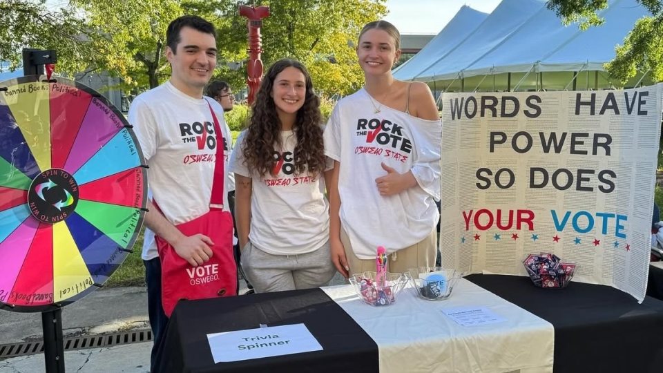 Sydney Mayer (center) tables with her peers for POL: 386: Vote Oswego.
